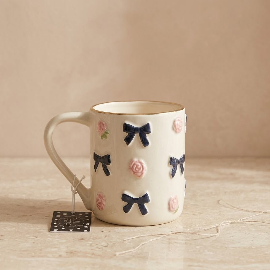TAZA BLANCA CON ROSAS Y LAZOS NEGROS