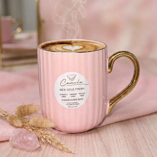 TAZA ROSADA CON ASA DORADA Y LINEAS