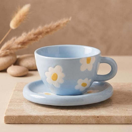 TAZA AZUL CON FLORES BLANCAS